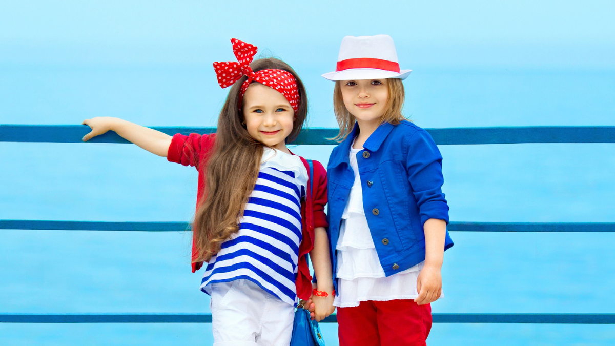 Fashion kids resting on the sea.