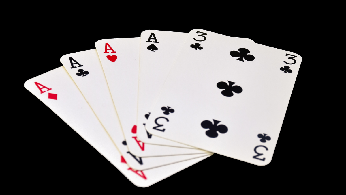 The combination of playing cards in poker on black background - Four of a Kind 2 player card games.