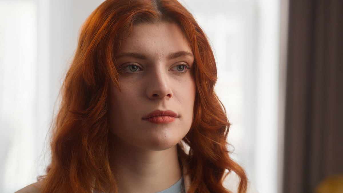 Frustrated Caucasian woman sad female disappointed girl portrait posing bored lady looking at camera negative facial expression close up pensive model upset emotion at home stress insurance mortgage.