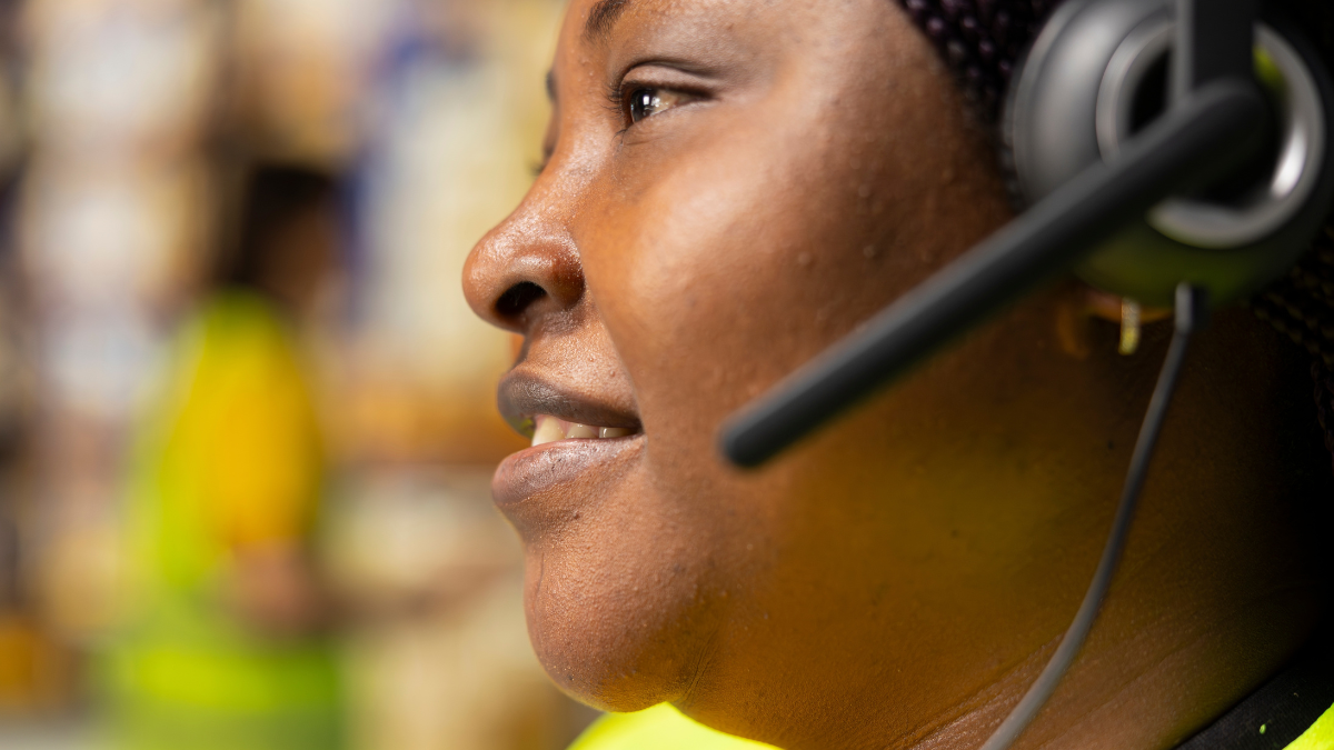 Close up of female customer support clerk speaks with clients about shipment details, helping with wrong address mix up on the help line. Woman resolves order, confirm airway bill numbers. (Help With Bills) How To Get Financial Assistance When You Need It.