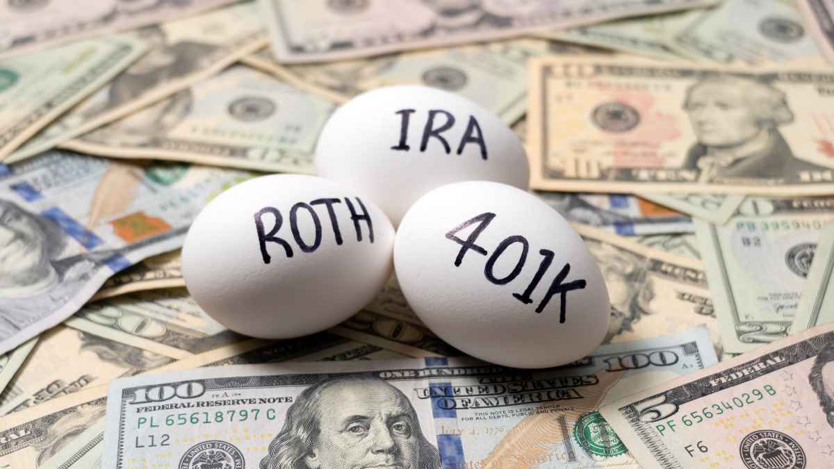 Money and nest eggs concept with white eggs labeled 401k, IRA and ROTH for retirement, savings, investment and financial planning.