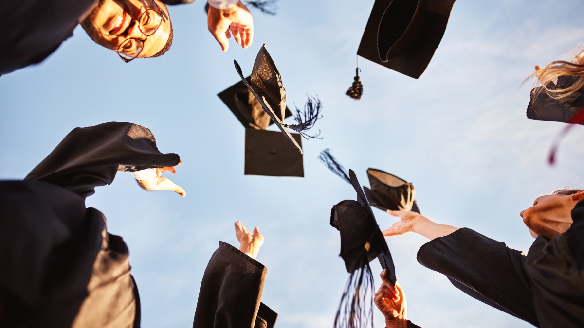 Hats, air and graduation of people, outdoor and celebration of achievement in college and education. Low angle, sky and group of students, victory and success in university, happy and friends. How To Pay For College.