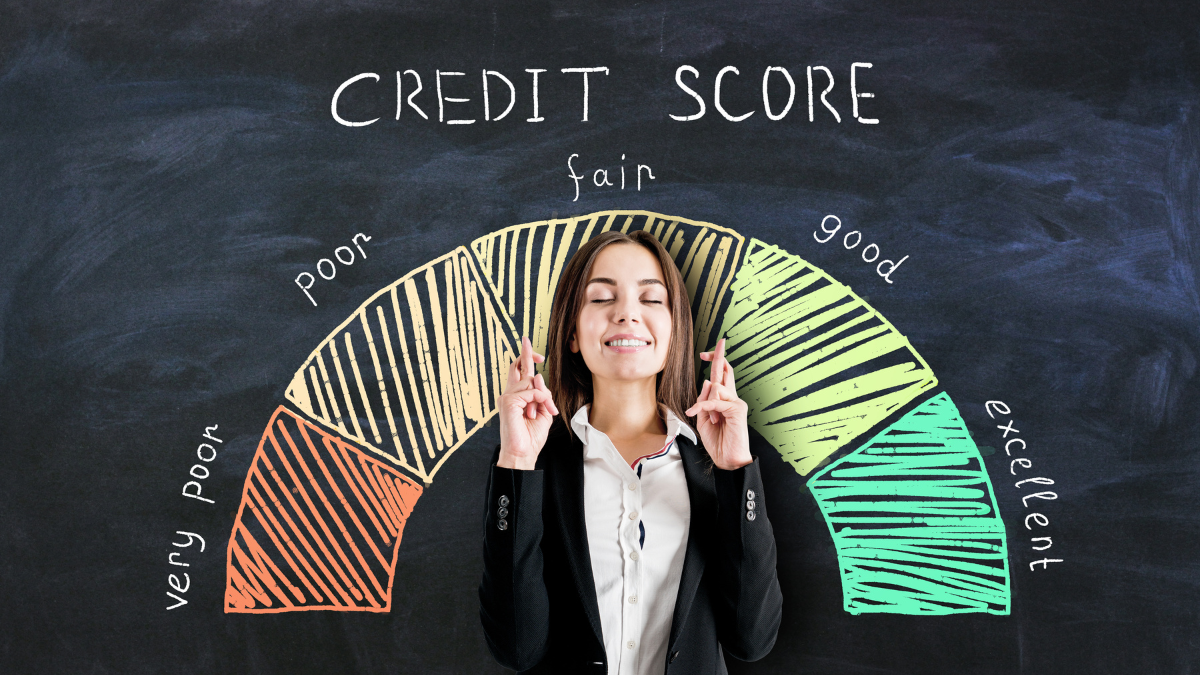 Bank loan concept with businesswoman crossing her fingers on blackboard background with credit score scale free credit report.