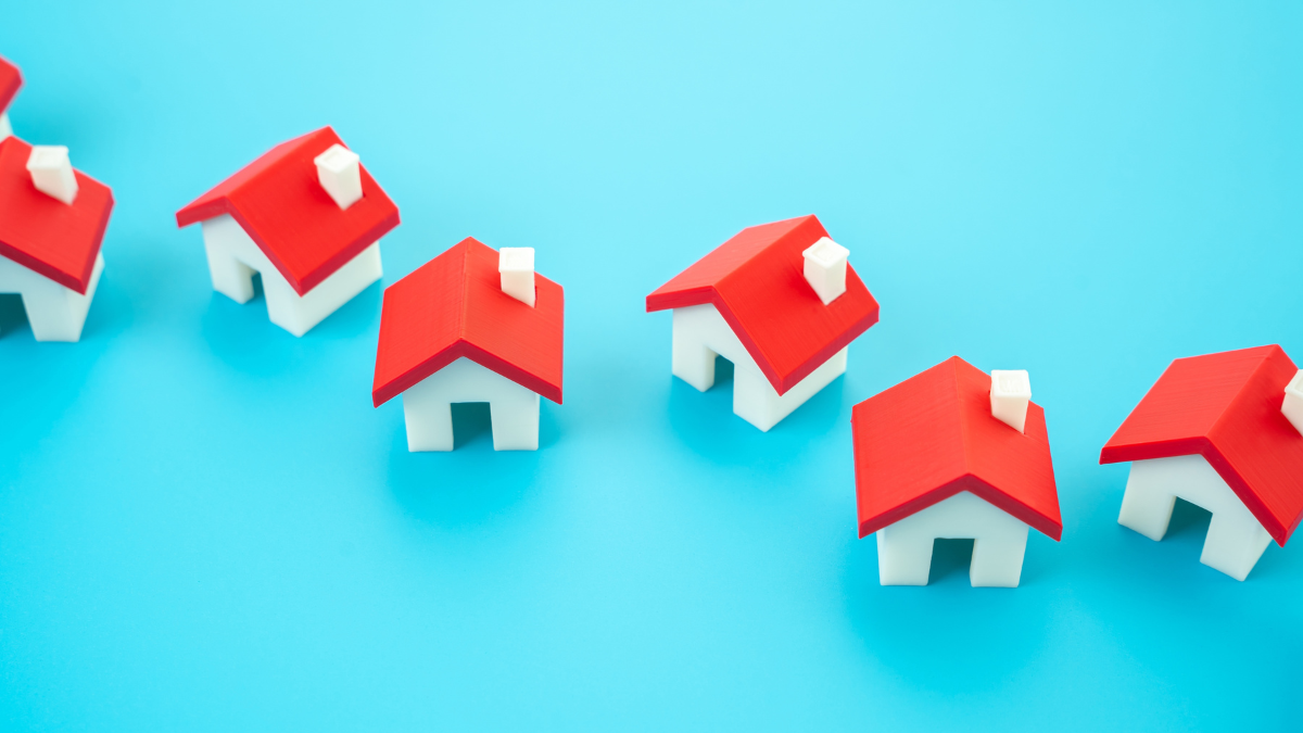 House figures in a line. Realtors service in buying and selling. Housing availability How To Buy a House With Bad Credit.
