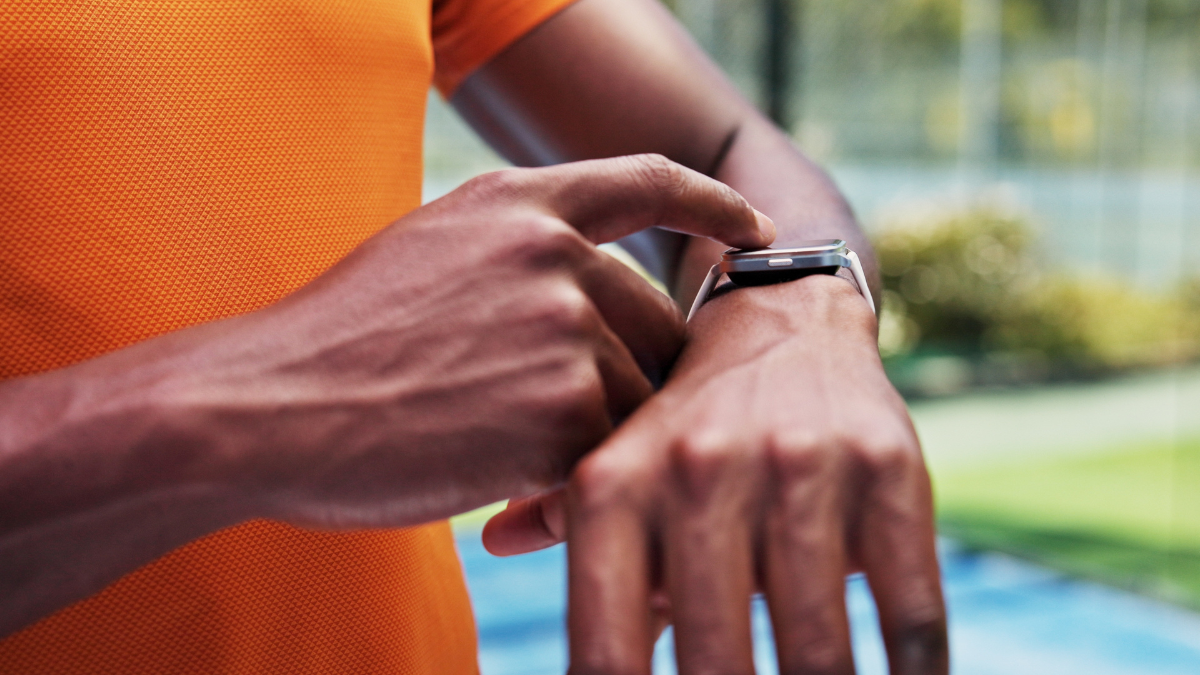 Hands, smart watch and click at tennis court for exercise, contact and timer for game at urban park. Person, stopwatch and iot clock with application, gear or outdoor for fitness at sports club _Pomodoro Technique.
