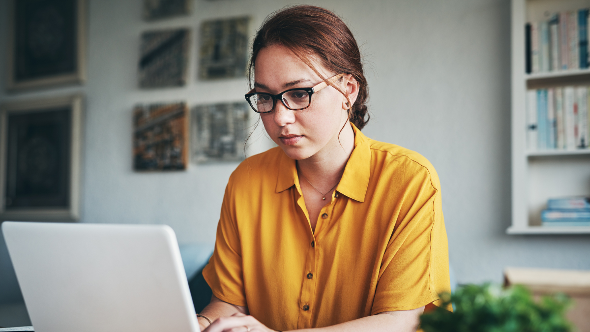 Transcription Jobs Woman, laptop and remote work for freelancer in home, online and research for writing article. Female person, check report and editing language on transcription, typing and upload journal on website.