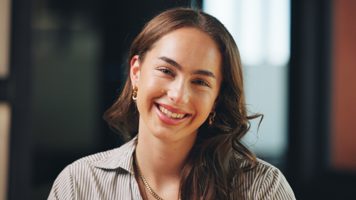 Portrait, employee and woman with smile, office or journalist with career development and creative. Ambitious, reporter and person with positive attitude for opportunity, media and newsroom in USA Career Coach,