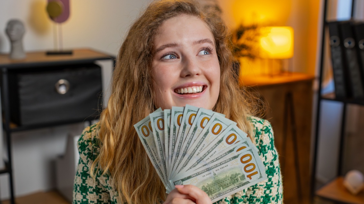 Rich Caucasian business woman girl earnings big profit success win lottery wasting money salary shopping more tips.