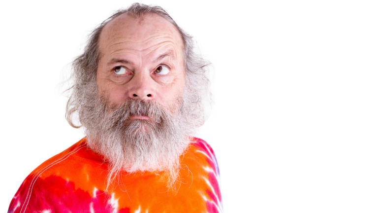 Baby Boomer with his Tie Dye T-Shirt, Thoughtfully Looking up
