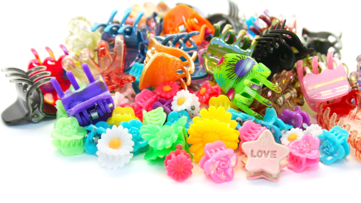 20 Things From the 90's That Haven’t Made a Comeback Yet 3 hair clips isolated on white background.