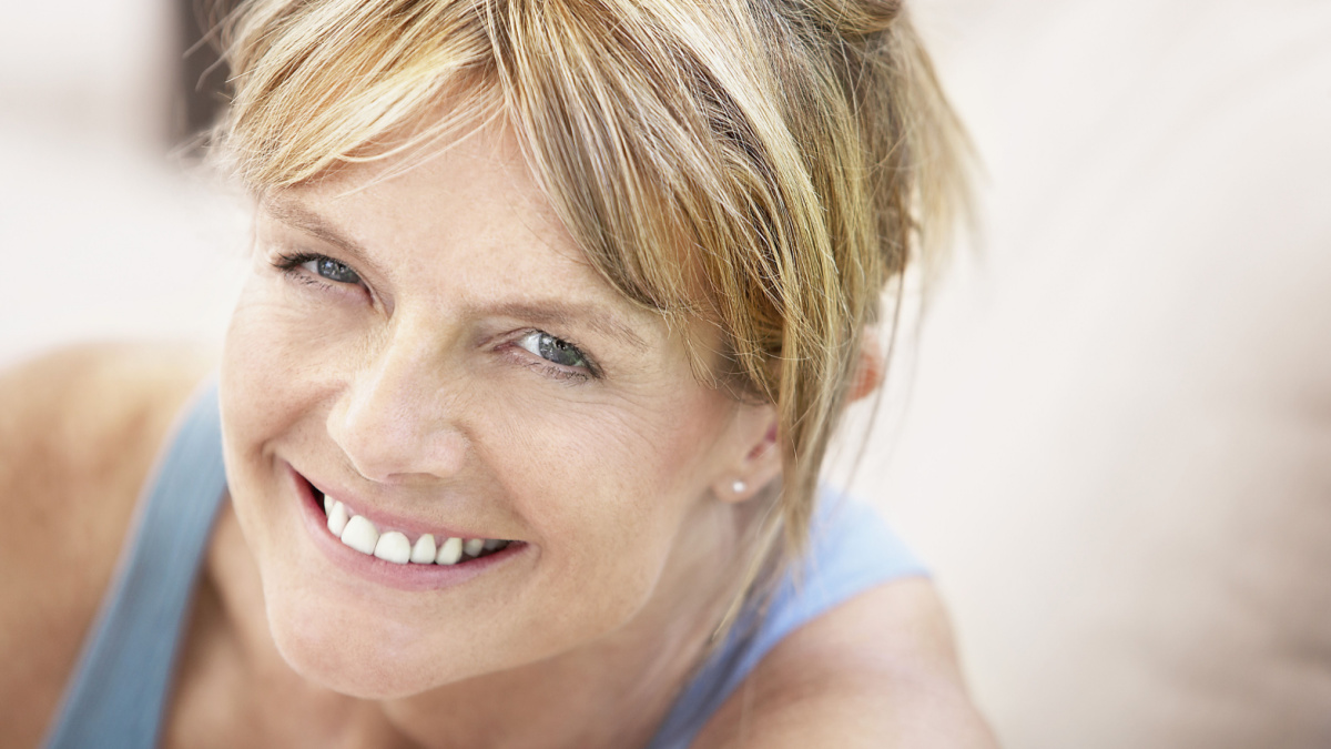 Stock Photo ID: 144533312 Closeup portrait of relaxed middle aged woman smiling.