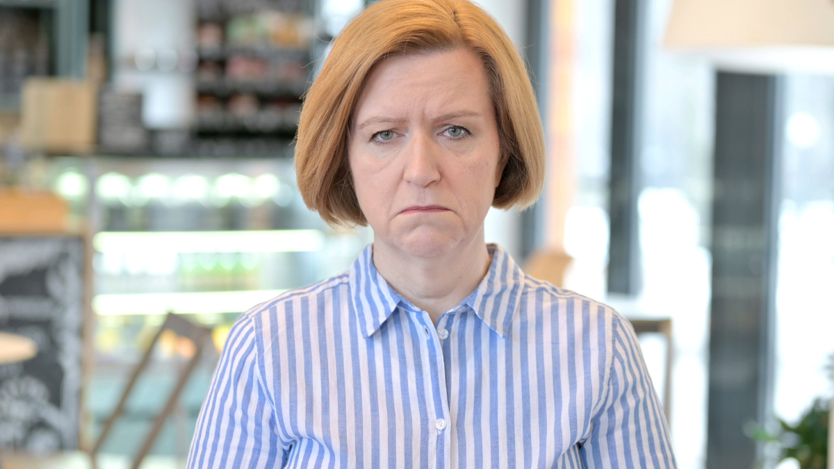 Portrait of Crying Creative Old Woman Looking at Camera.