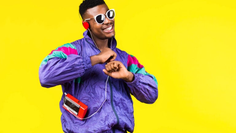 African American young man, in a jacket in the style of the 90s, with a retro cassette player, hears music, the mood of dancing and fun, yellow and purple colors.