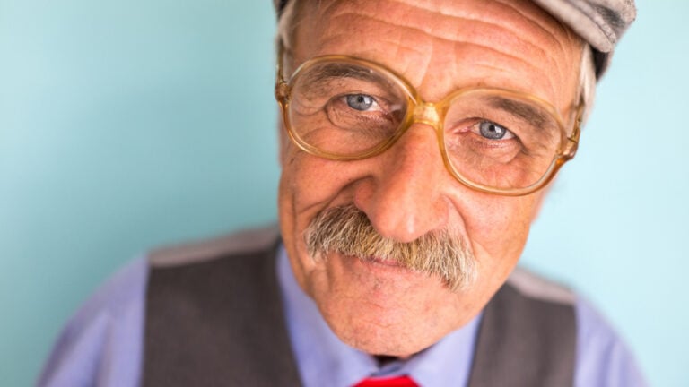 Portrait of a smiling and confident senior good looking business man.