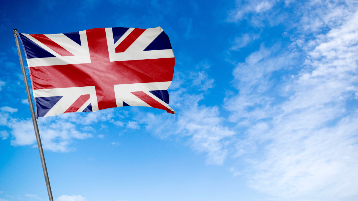 United Kingdom Flag - The classic flag of the United Kingdom waving proudly. Also known as the Union Jack, this flag features a captivating blend of red, white, and blue with the distinctive cross.