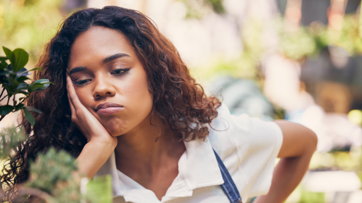 Will I always feel this way. Shot of a young florist looking bored and tired at work. SH frugal ways to cure boredom.