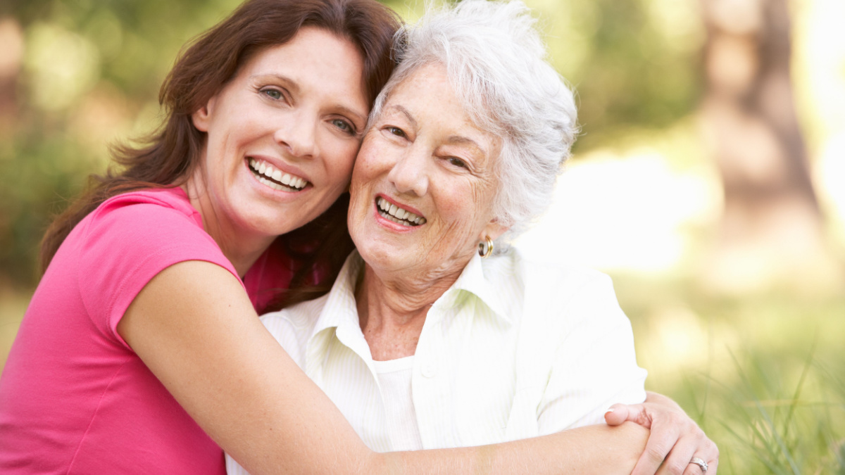 Senior Woman With Adult Daughter In Park.