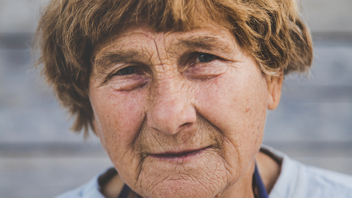 Portrait of an old woman. Selective focus. People. free government money.