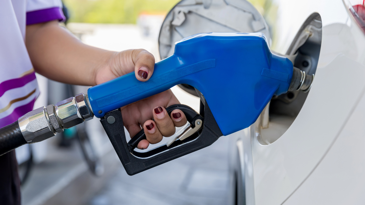 Car fill with gasoline at a gas station. Gas station pump. how to save money on gas.