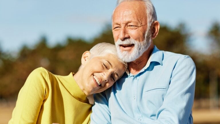 Happy active senior couple having fun outdoors.