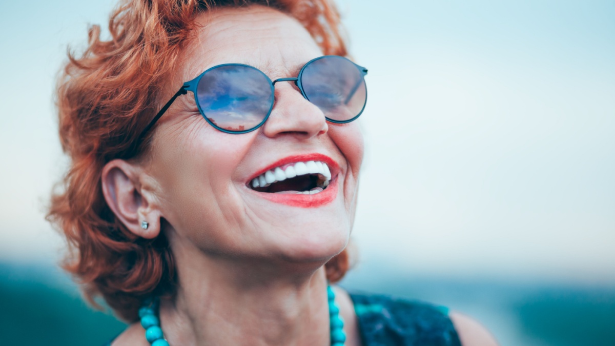 Happy mature woman enjoying life.
