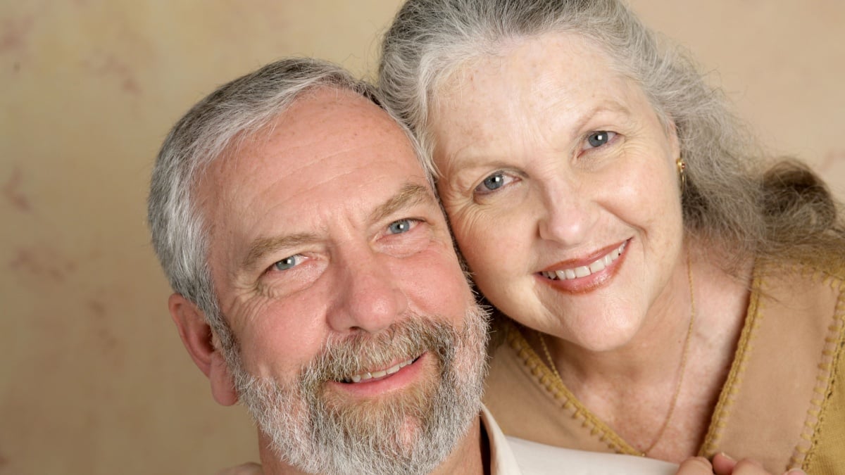 Portrait of a beautiful gray haired middle aged couple in love.