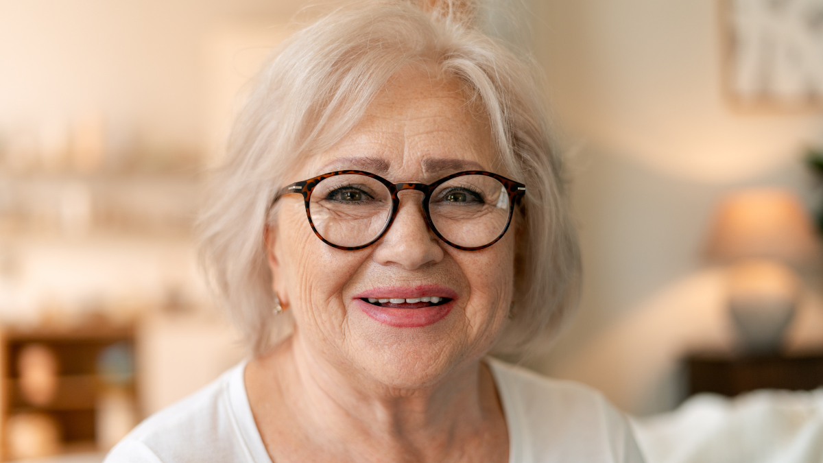 Portrait of a happy elderly woman with white hair smiling cheerfully, reflecting joy, well being, and a positive lifestyle Old-Fashioned Frugal Living Tips.