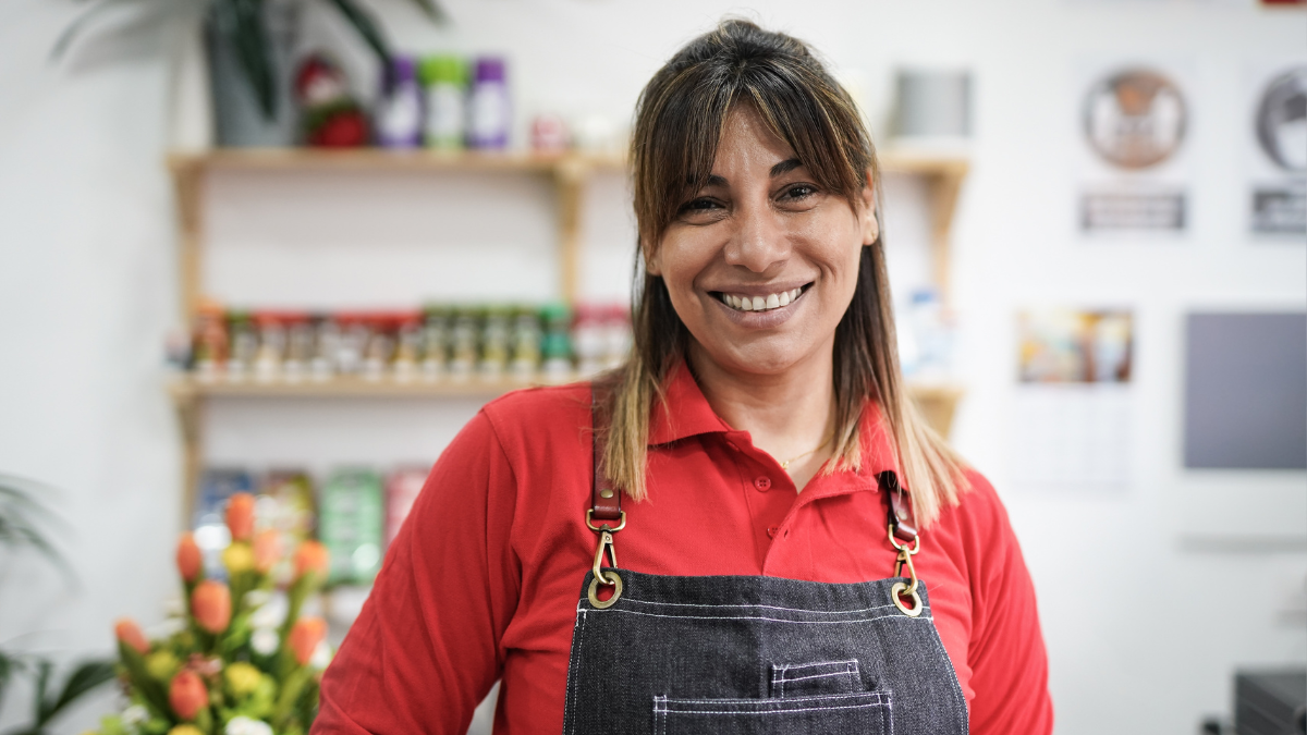 Mature latin woman working in a supermarket.