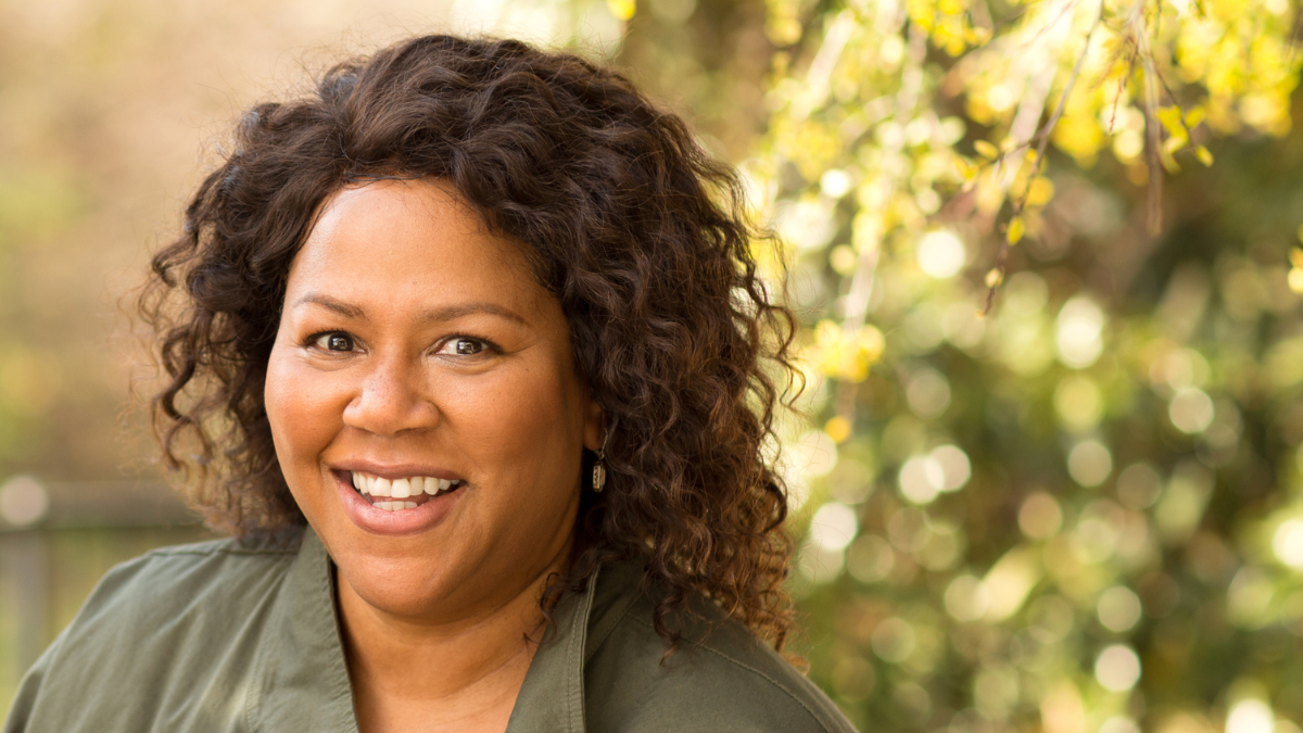 Mature African American woman smiling.