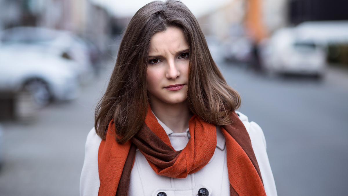 Unhappy wife. Angry woman outside in the city of Brussels Belgium looking at you camera children husband about to yell scold.