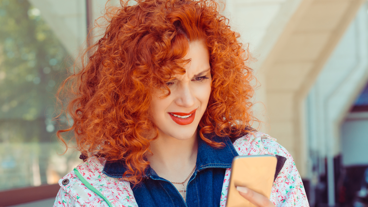 Portrait of young sad annoyed woman, receiving bad sms.