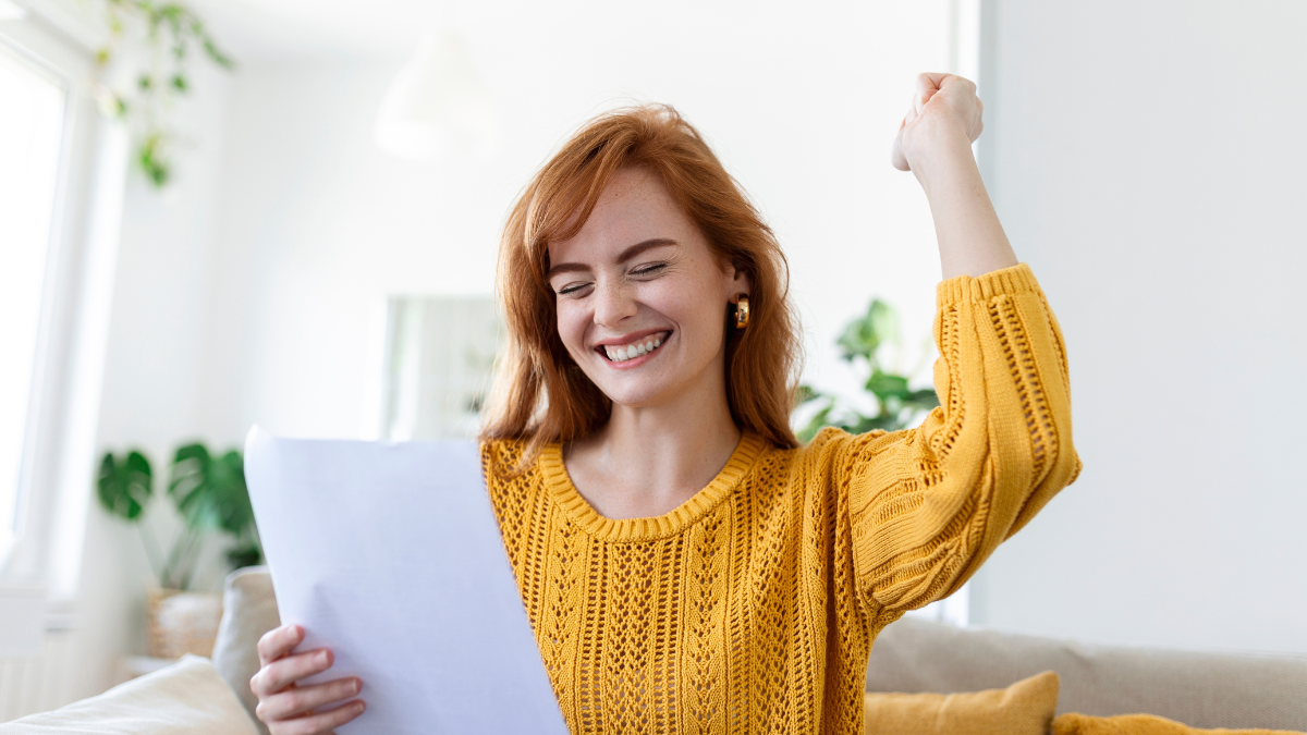 Excited young woman hold paper letter feel euphoric receiving job promotion or tax refund from bank, happy woman reading paperwork document smiling of good pleasant news, getting student scholarship.