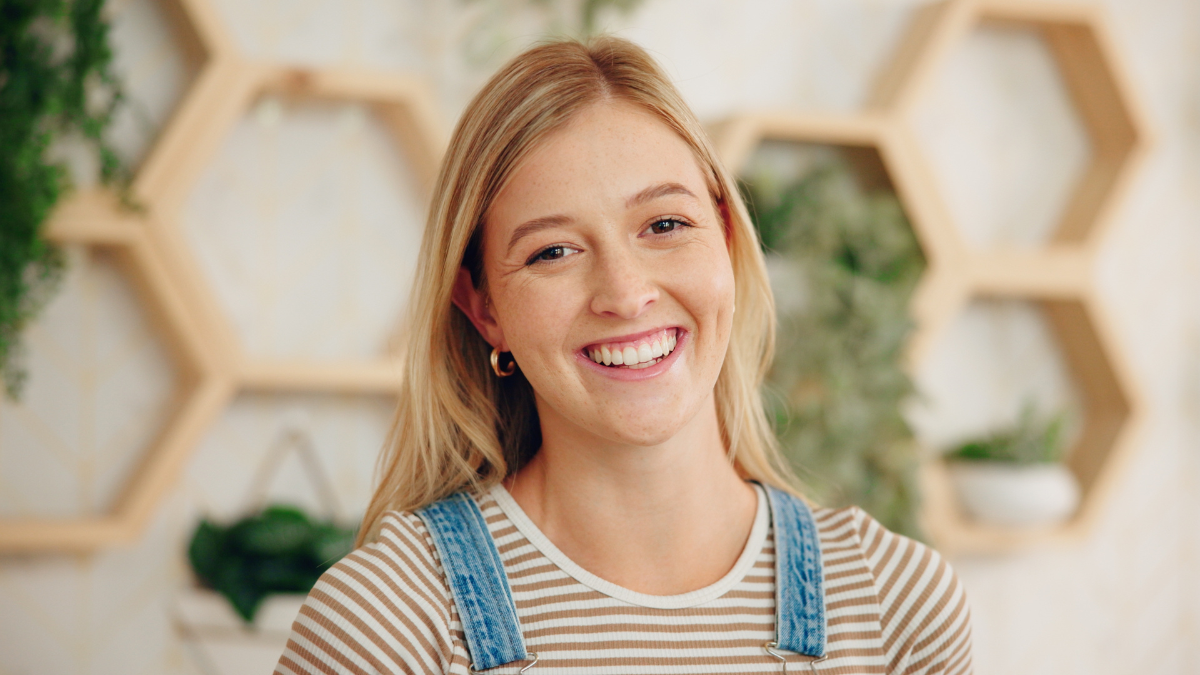 Woman, portrait or florist with smile for plant growth, agriculture or eco friendly business in store. Happy face, female person or environmentalist with joy for flower shop, startup or agro service.
