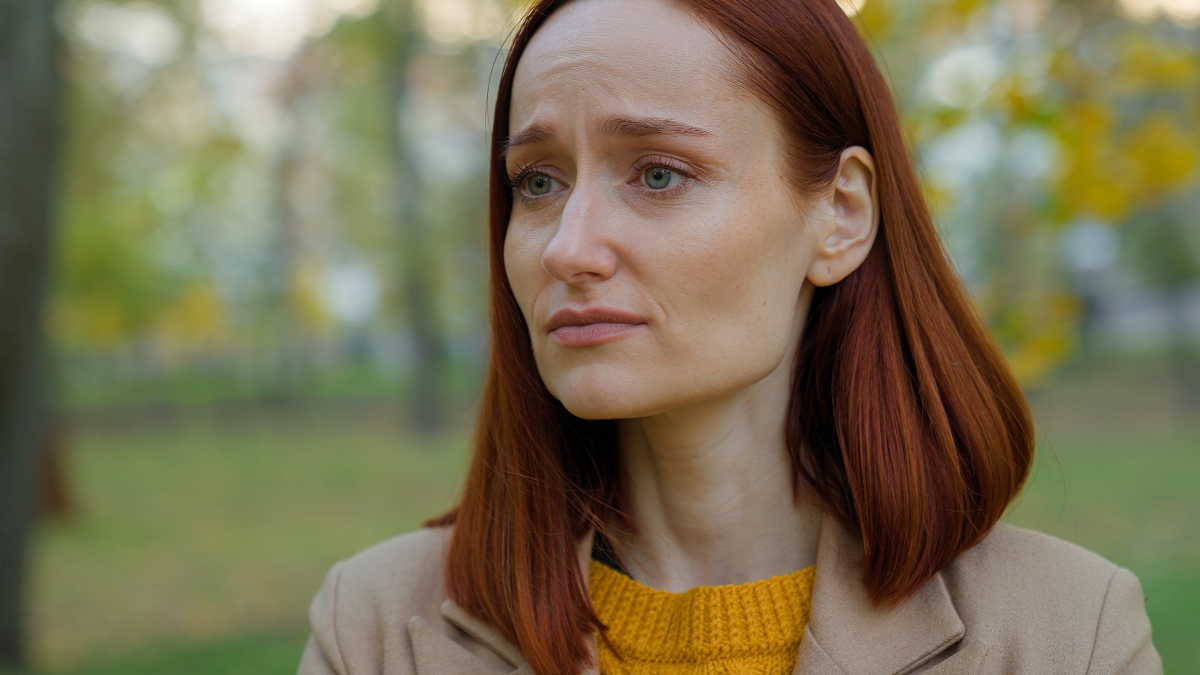 Pensive sad upset negative emotion thinking Caucasian woman girl female lady think pondering problem solution stress autumn park outside depression seasonal bad mood trouble date cancel frustrated.