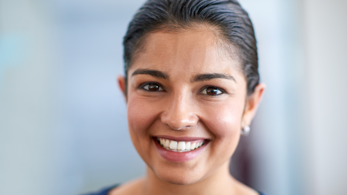 Positive and professional. Closeup portrait of an attractive young businesswoman in her office.