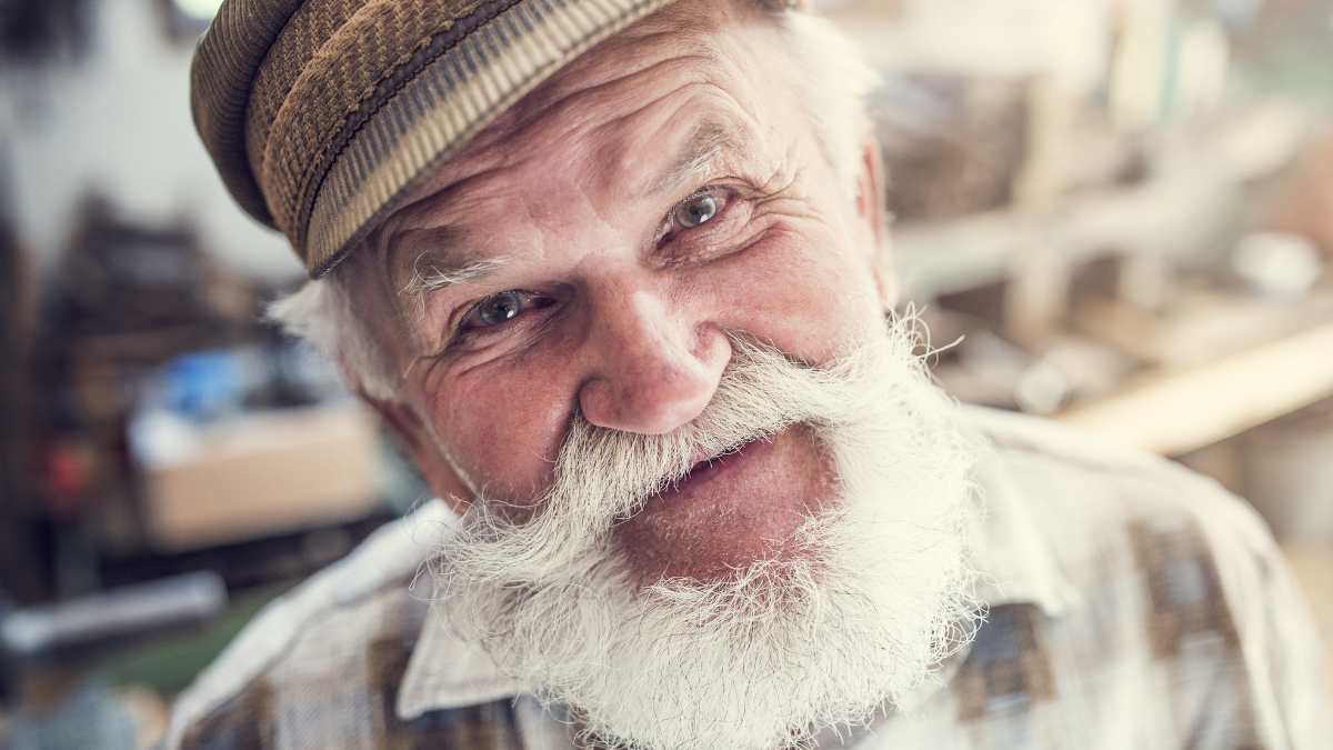 Closeup of a senior craftsman in his workshop.