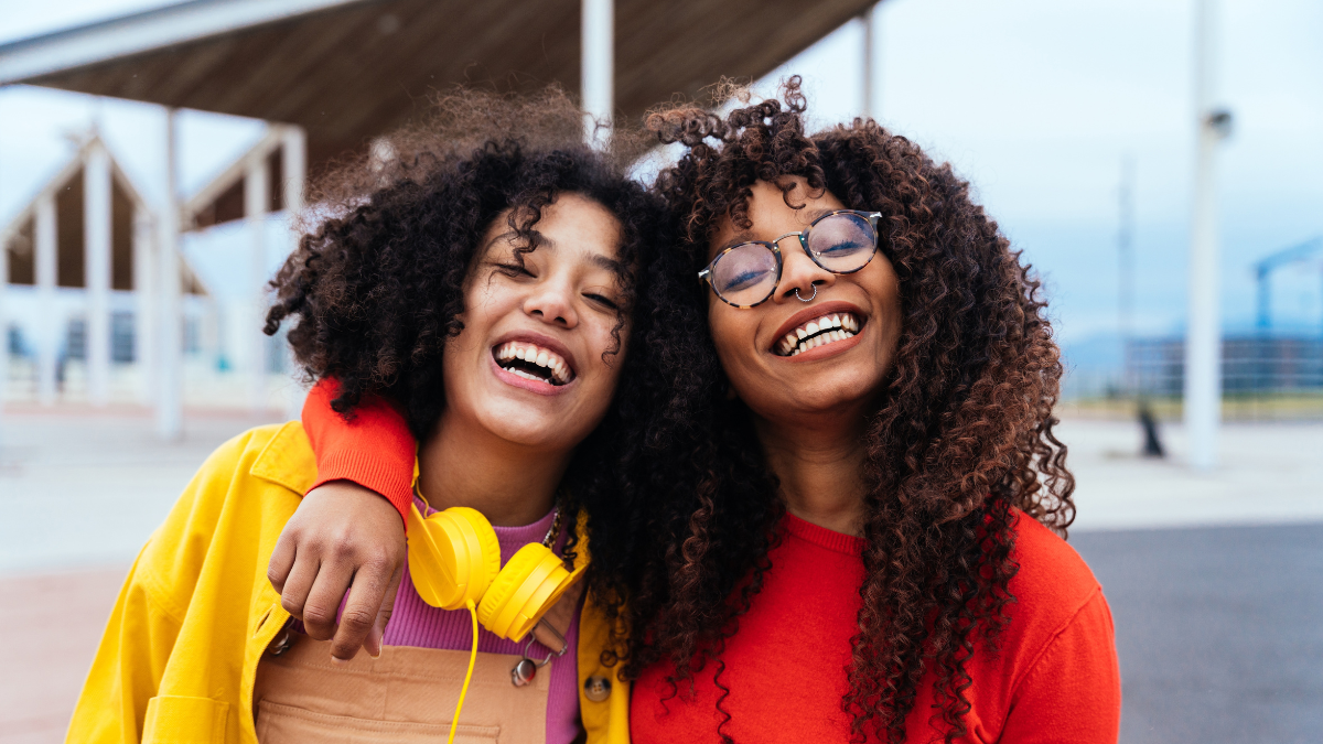 young happy women having fun outdoor , laughing and sharing good mood. Teenagers friends spending time outdoor in Barcelona.