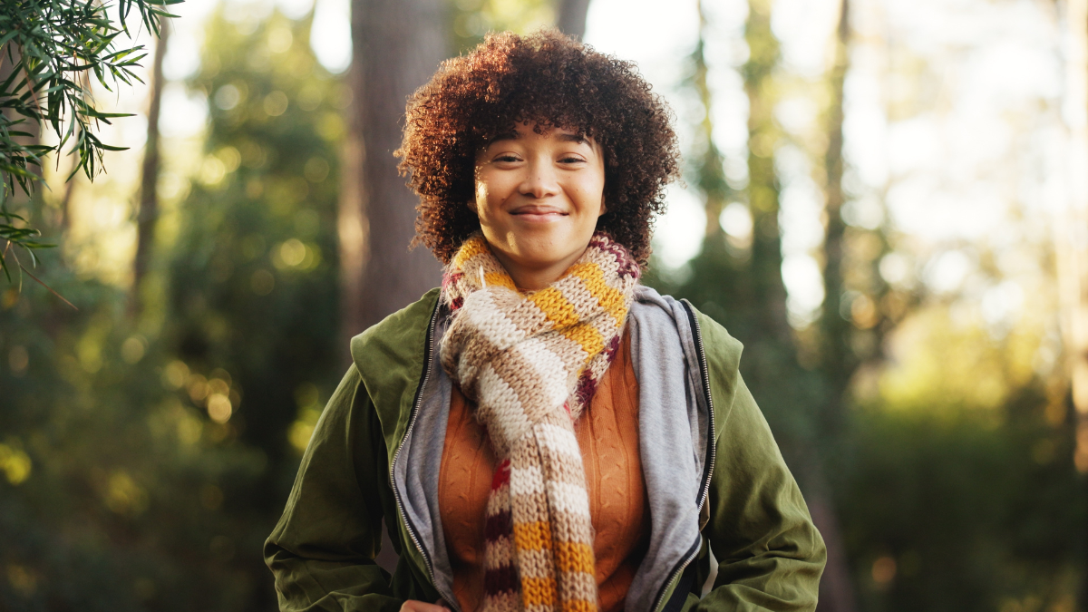 Relax, hiking and portrait of woman in nature for trekking, adventure and explore wilderness. Eco tourism, backpacking travel and journey with person in forest for vacation, peace and wellness trip.
