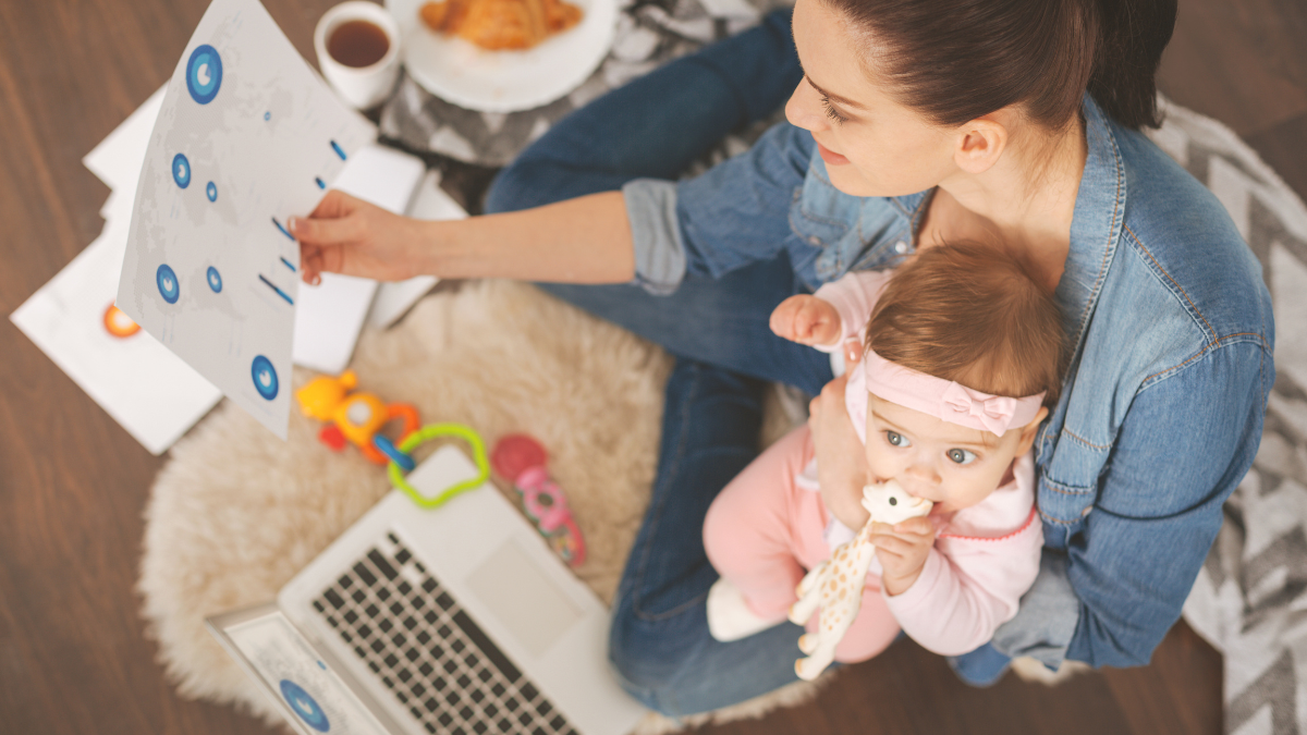 Top view photo of single mom working at home.
