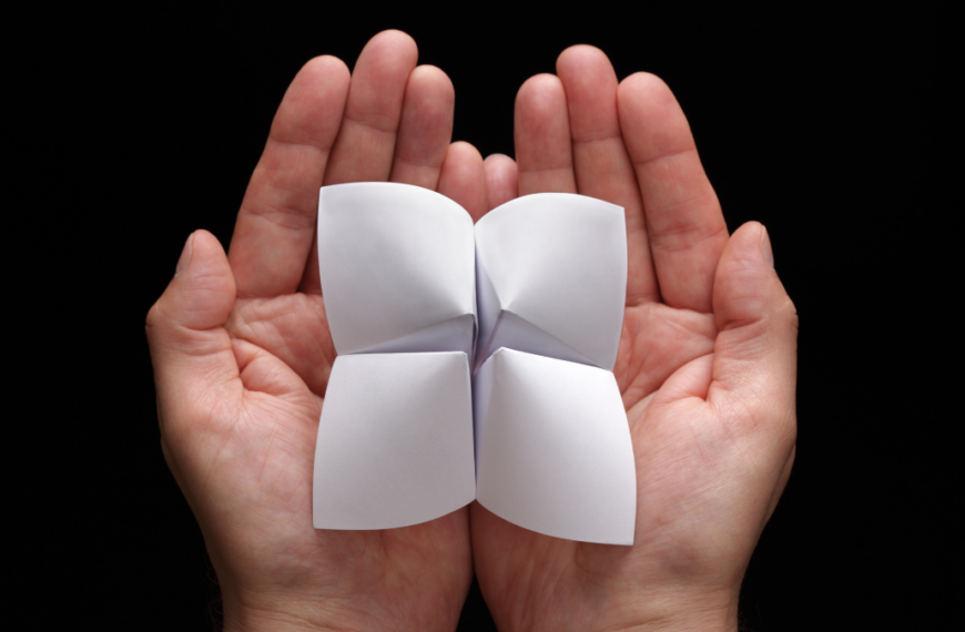 Origami fortune teller with blank choices in cupped hands is a grandma hobby.