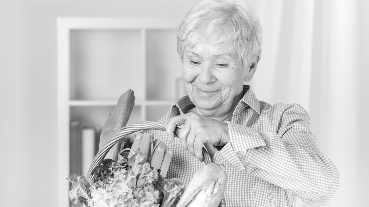 How To Budget Like Grandma To Maximize Your Savings 1 Elderly woman with shopping basket at home.