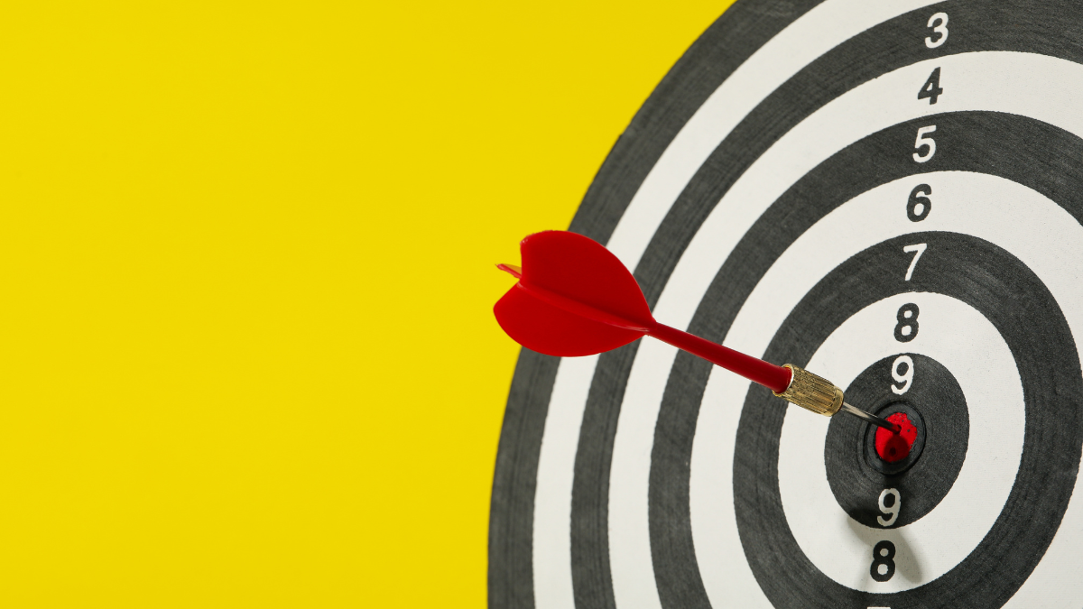 Target, dartboard, hitting the center. Winning goals business concept.