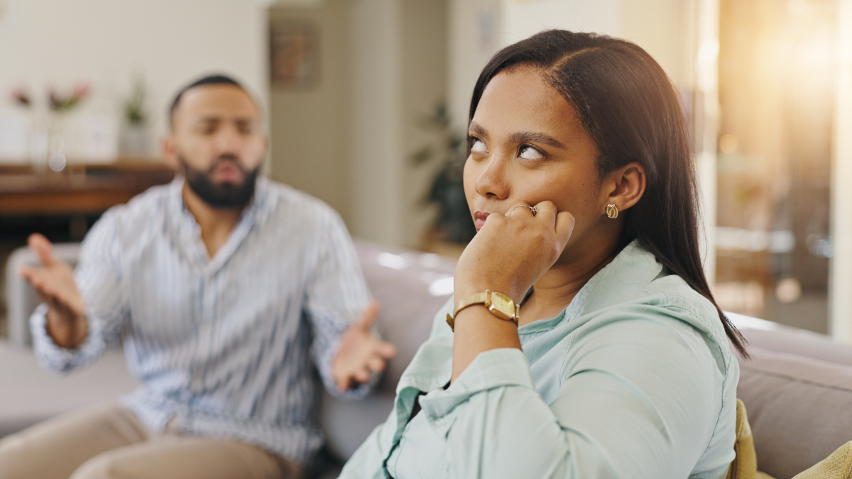 Woman, frustration and couple fighting in home, roll eyes and argument on toxic relationship.