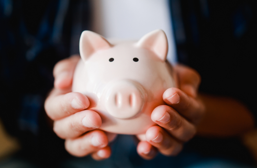 Hands holding piggy for saving money. Invest and financial bank concept.