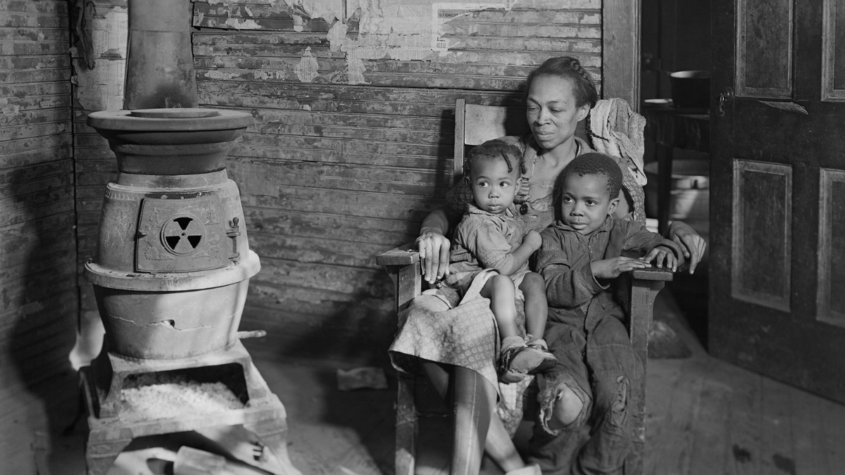 Wife and children of an unemployed African American coal miner in Scott's Run, West Virginia. Photo by Lewis Hine, March 1937.