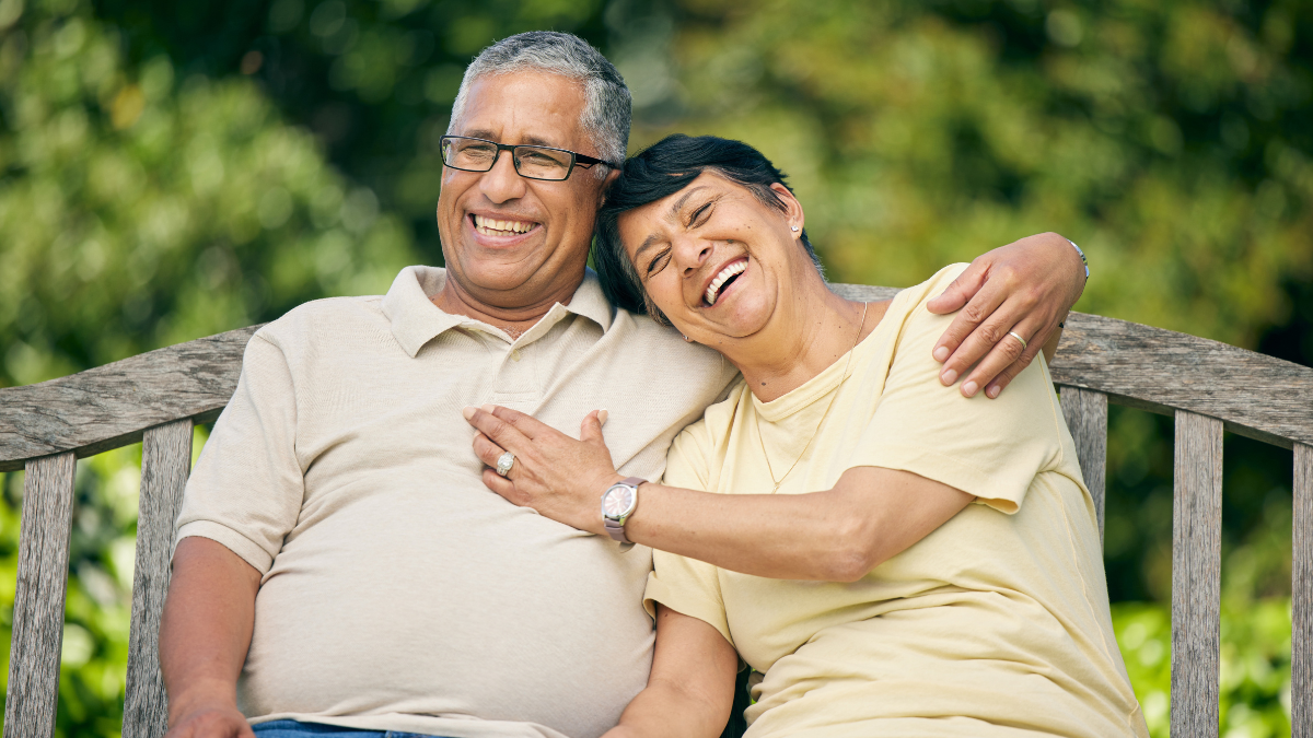 Park, hug and senior couple with love, smile and retirement with quality time, happiness and marriage. Romance, happy elderly woman and old man outdoor, embrace and affection with a relationship.