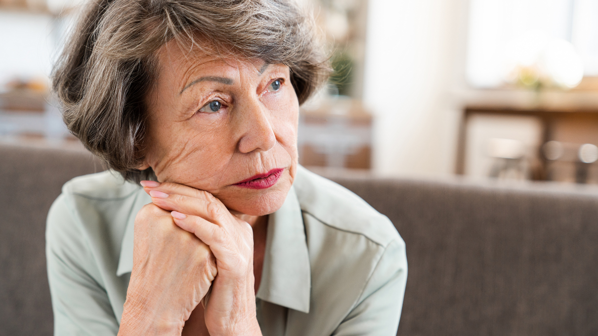 Sad tired exhausted caucasian old woman thinking about future past having nostalgy grief. Grandmother suffering from pain depression loneliness at home.