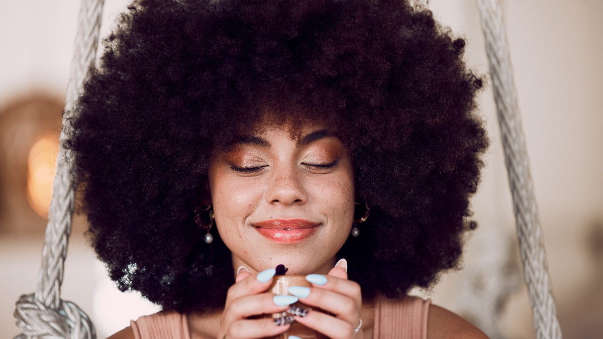 Black woman, coffee or tea at a cafe to relax, calm and peace with natural afro hair in brazil while thinking and smelling aroma. Female drinking cup for morning motivation, inspiration and happiness. How to Budget When You Don't Want To