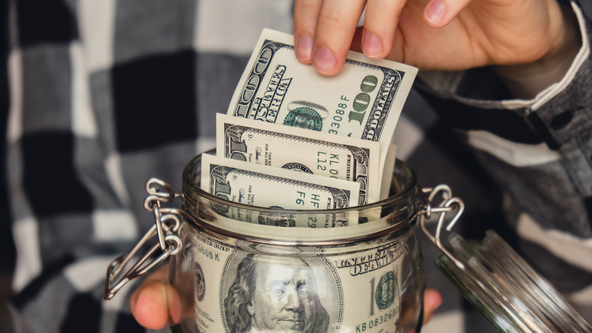 Dollar banknote saving money in glass jar. Unrecognizable woman moderate consumption and economy Collecting money. Tips. Business, finance, saving, banking and people concept. Extra money, Best Residual Income Ideas.