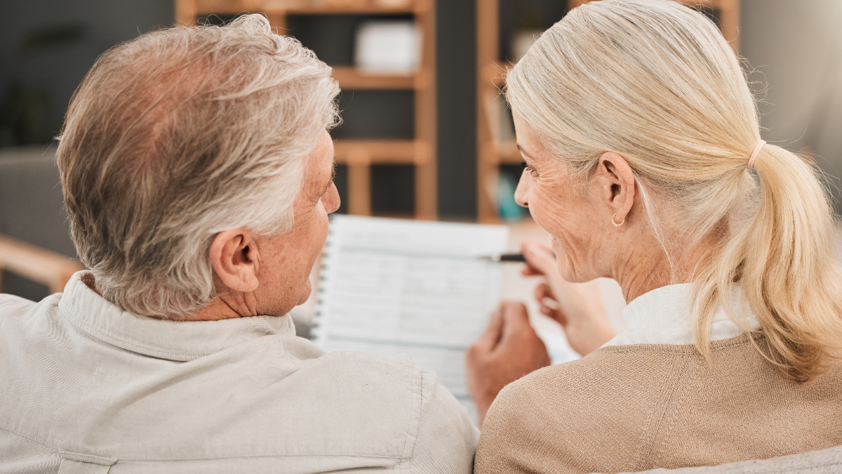 Old couple with life insurance application, retirement fund and paperwork, partner with property investment or asset management. People in marriage, financial planning together and policy documents Facts About Retirement Planning.